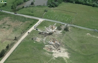 Aerial view of damage to the McNutt Memorial United Methodist Church and adjacent home near Mount Vernon. ~1.08 Mb